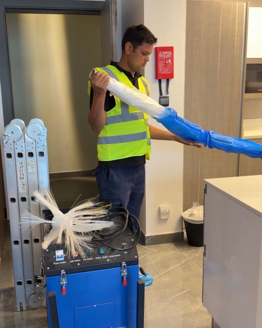AGEC technician performing AC duct cleaning in a Dubai apartment